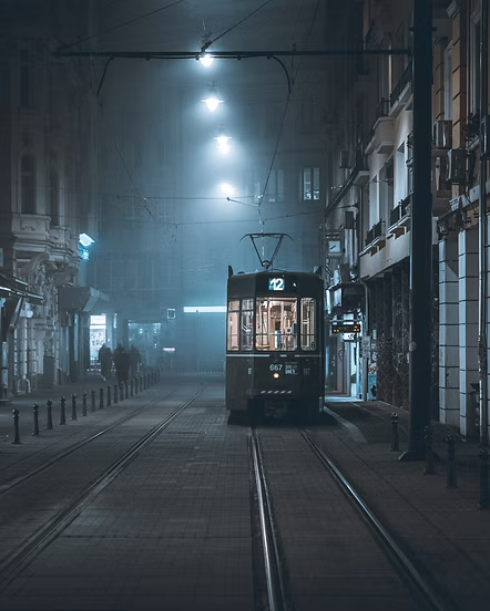 tram on city streets at night. 